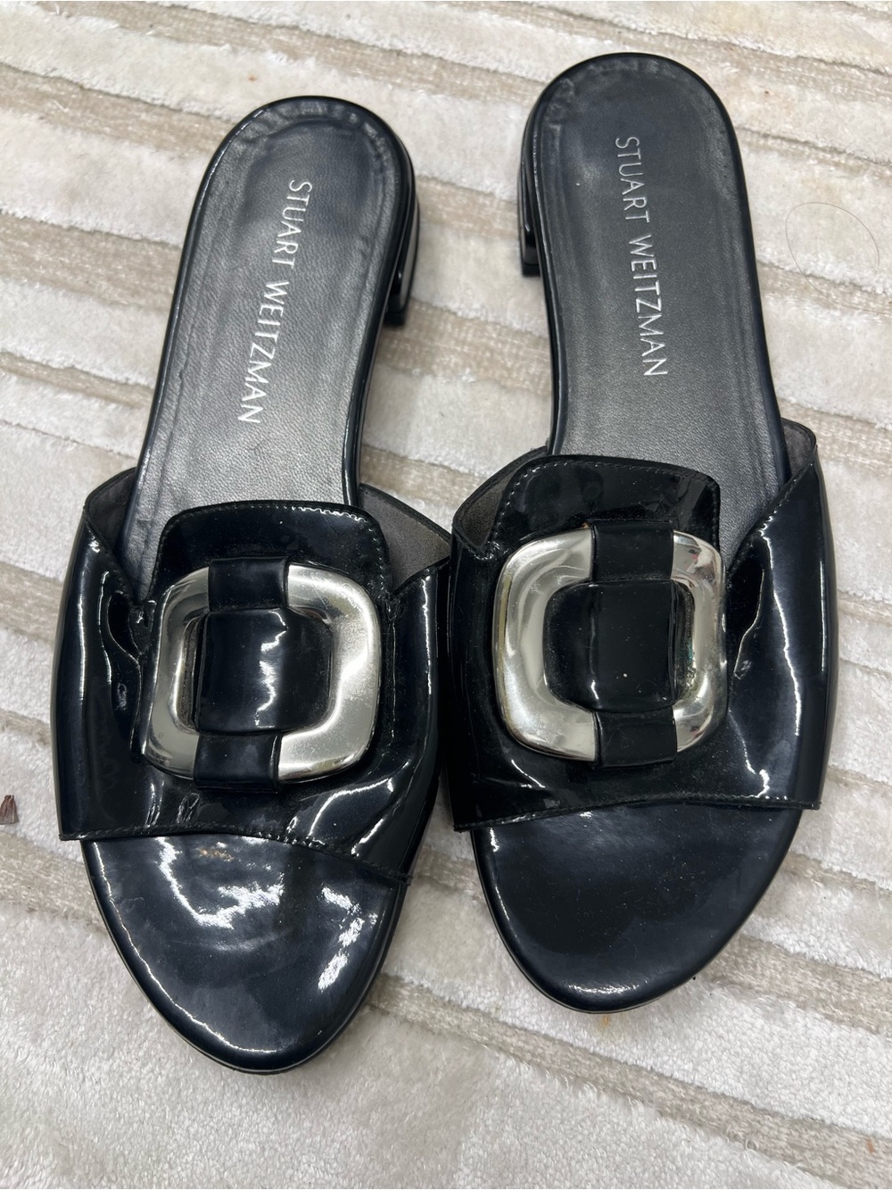 Stuart Weitzman Black Patent Slide Sandals with Silver Buckle Accent
